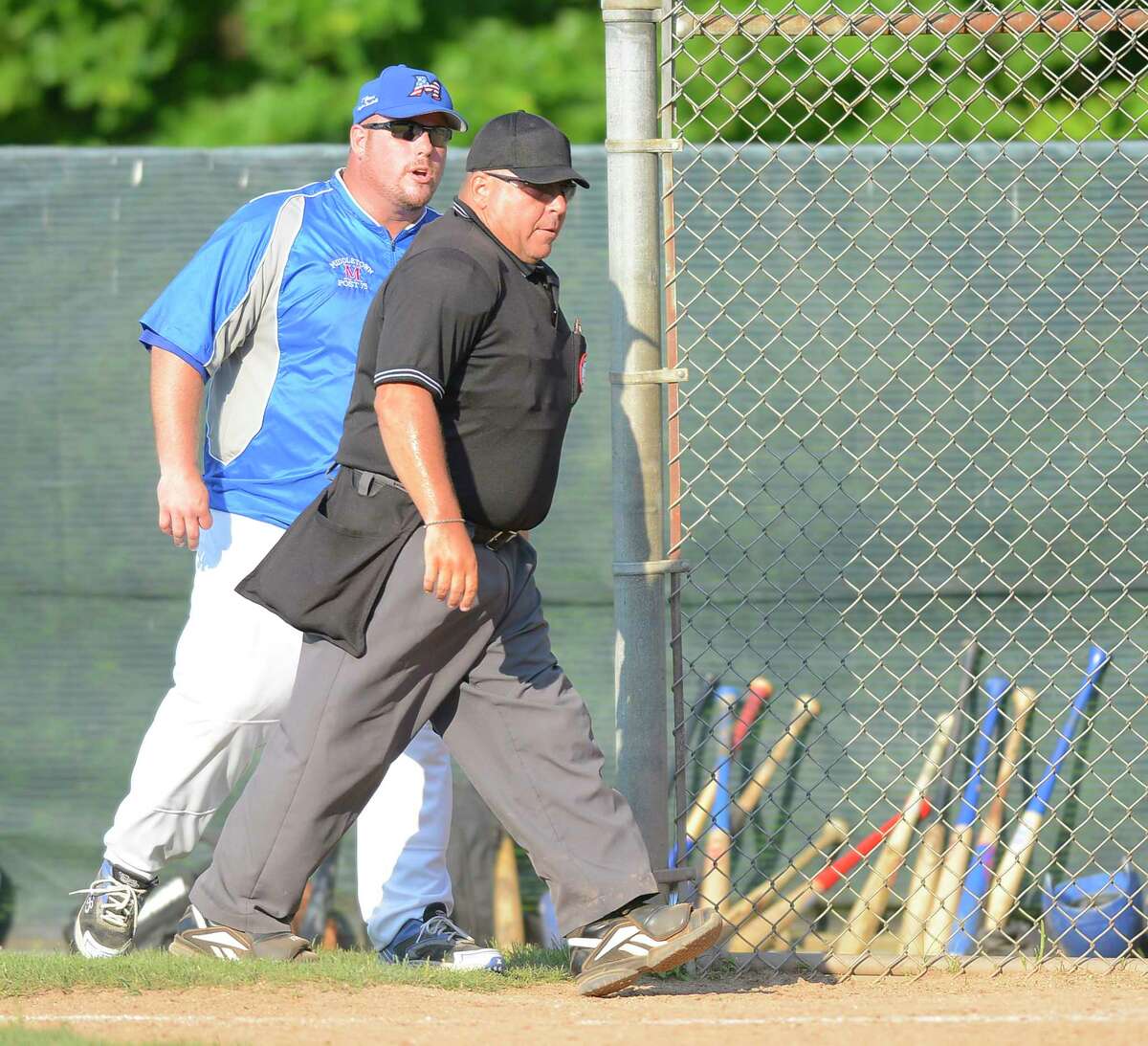 Middletown Coach Tim D’Aquila gives Umpire Pete Stokes an ear full after Stokes ejected him in the bottom of the second inning of a Senior American Legion State Tournament at Greenwich High School on Thursday July 18, 2017 in Greenwich, Connecticut. Greenwich defeated Middletown 8-1.