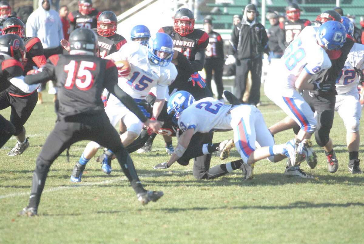 Jake Ober (15) runs the ball during Coginchaug’s state-playoff clinching victory over Cromwell