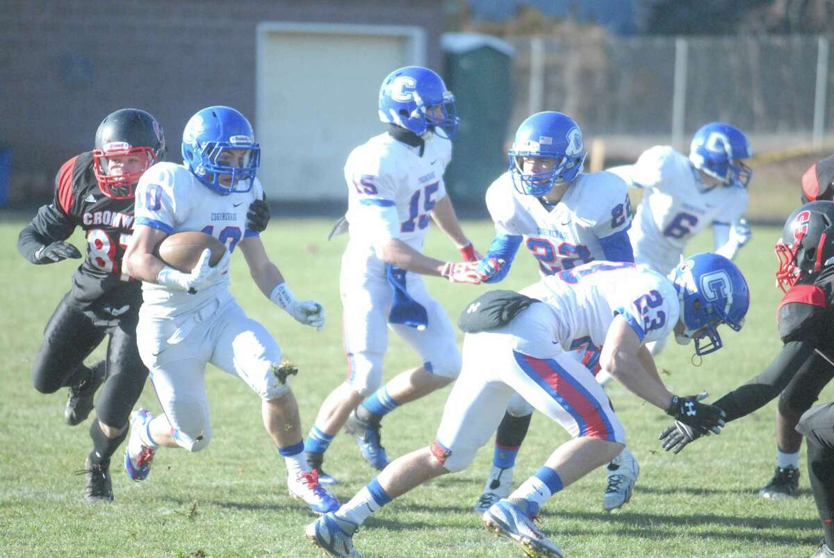 Jack Granger runs the ball for Coginchaug during its playoff-clinching win over Cromwell on Thanksgiving morning