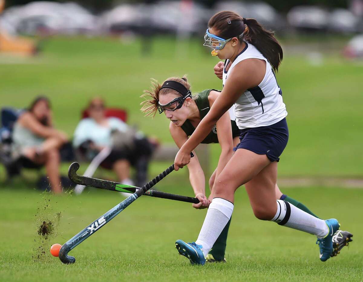 Hamden Hall sophomore midfielder Molly Anderson battles Cheshire Academy captain Dechan Choden, Wednesday, September 13, 2017, at the Beckerman Athletic Center in Hamden. Anderson scored the Hornets second goal in the first half, defeating Cheshire Academy, 3-1. (Catherine Avalone/Hearst Connecticut Media)