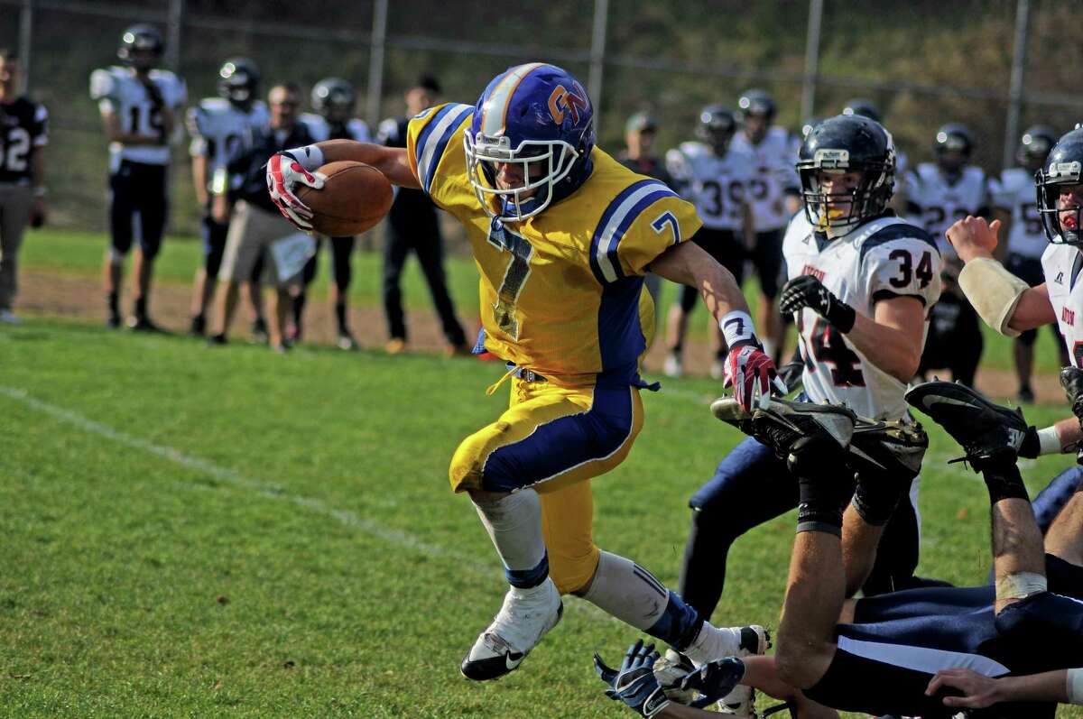 Gilbert/Northwestern’s Tony Ortiz breaks multiple tackles on his way to a touchdown run during the season against Avon.