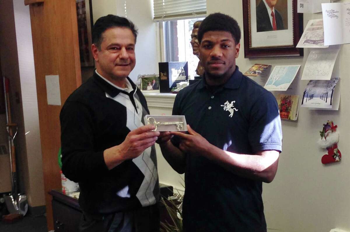 Ansonia’s Arkeel Newsome (right) receives the key to the city from Mayor David Cassetti on Monday, Dec. 16 at City Hall.