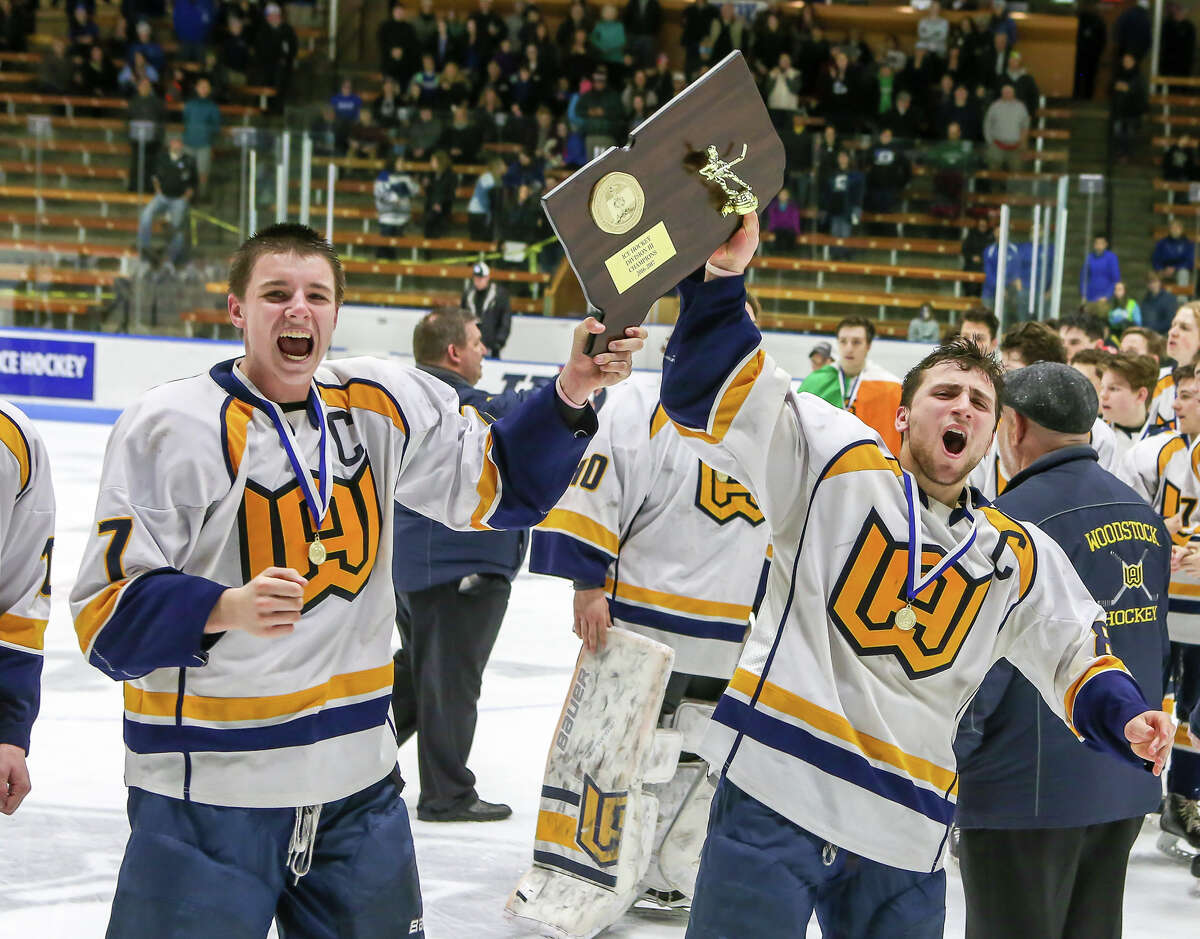 (John Vanacore/New Haven Register) Woodstock Academy’s boys hockey team celebrates its 2017 Division III championship over Hall/Southington Saturday, March 18, 2017 at Ingall’s Rink at Yale University. The school is mulling over leaving the CIAC for the NEPSAC.