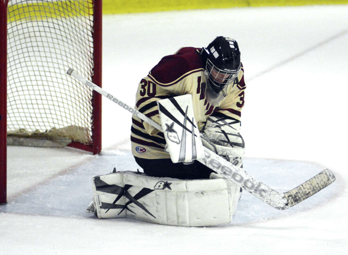 Photo by Dave Phillips/ North Haven goalie Andrew Graziano makes one of his 50 saves during the Indians’ 3-2 win over Branford on Thursday.