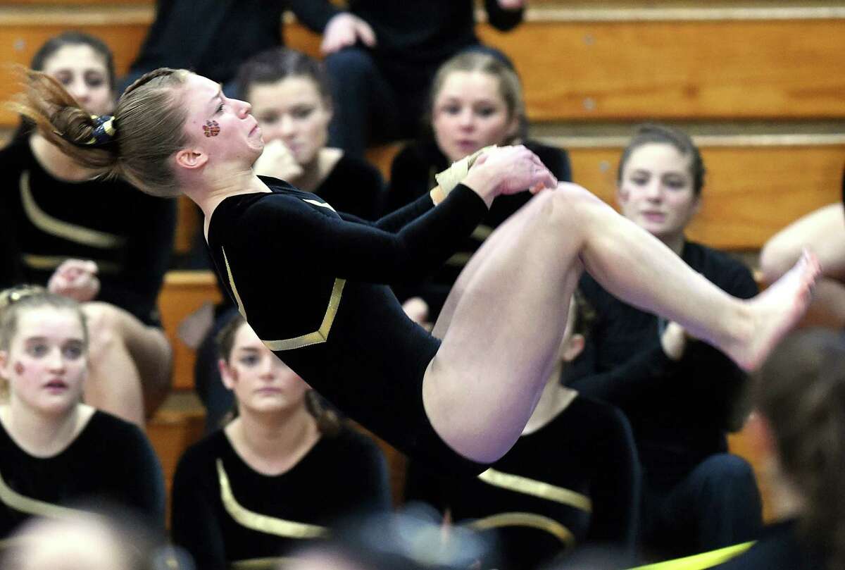 (Arnold Gold-New Haven Register) Erin Naclerio of Daniel Hand flies through the air during the vault event during the SCC 2017 Gymnastics Championship at Jonathan Law High School in Milford on 2/10/2017.