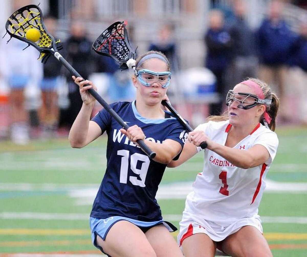 At left, Sophie Sudano (19) of Wilton is defended by Maggie O’Gorman (1) of Greenwich just before Sudano scored a goal during the second half of the CIAC Class L girls high school lacrosse semifinal match between Greenwich High School and Wilton High School at Brien McMahon High School in Norwalk, Conn., Tuesday, June 6, 2017. (Photo: Bob Luckey Jr. / Hearst Connecticut Media)