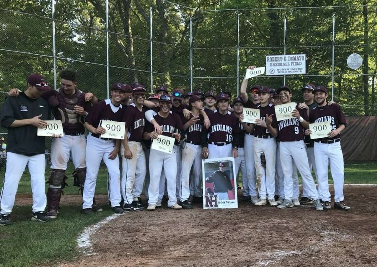North Haven’s baseball team gathers at home plate to celebrate a 7-6 victory over Amity and coach Bob DeMayo’s 900th victory in the SCC quarterfinals at DeMayo Field (Photo Pete Paguaga, Hearst Connecticut Media)