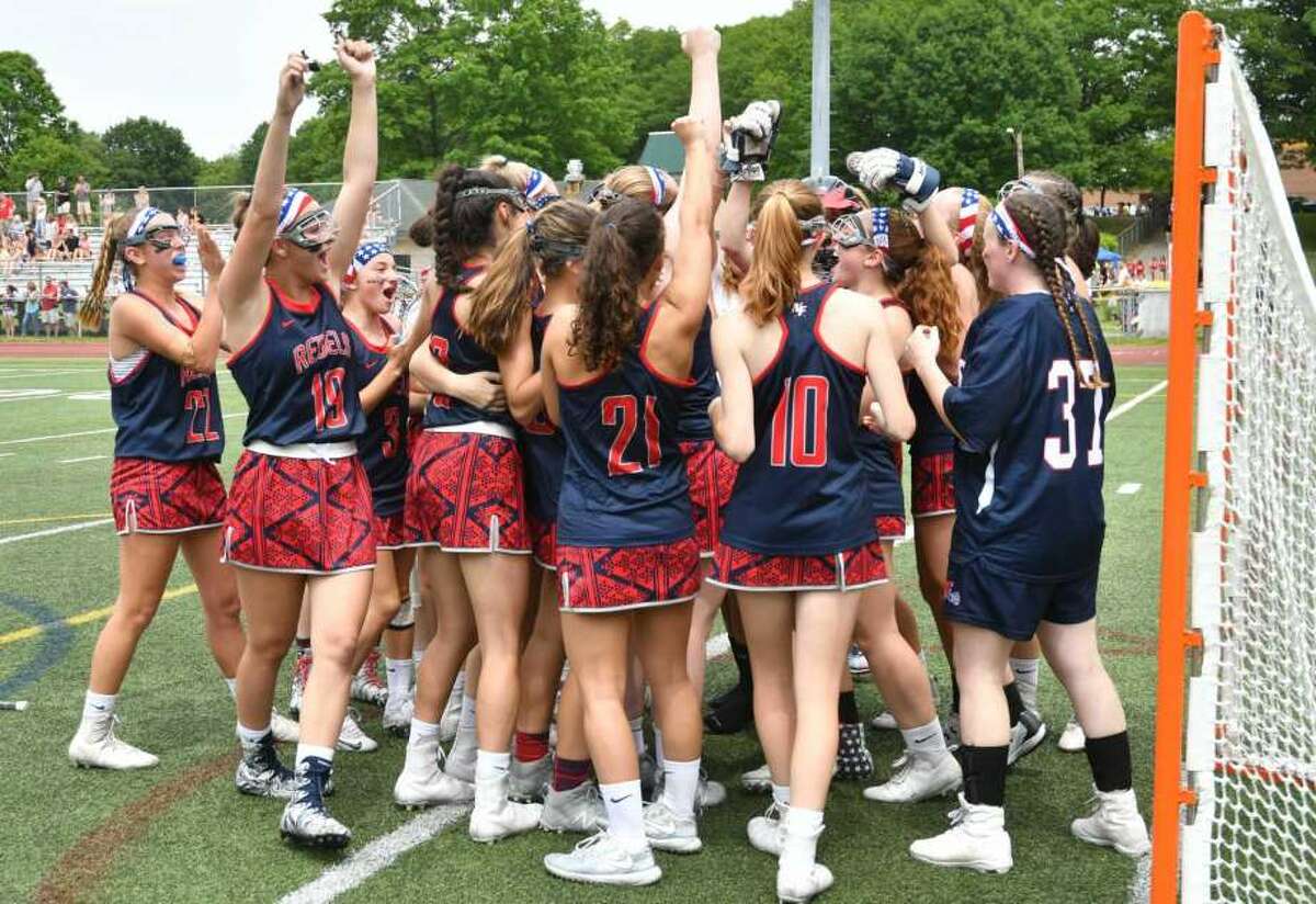 The New Fairfield Rebels celebrate a 9-6 victory over the East Catholic Eagles for the CIAC Class S Girls Lacrosse Championship on Saturday June 9, 2018, at Jonathan Law High School in Milford, Connecticut.