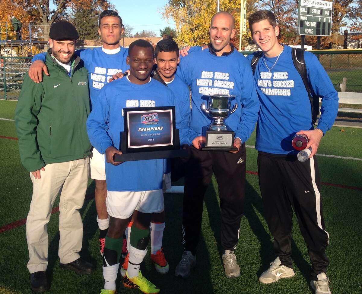 Coach Jared Sheikh along with some of his players, after leading Elms College to the NECC conference championship this past fall and a berth in the Division III NCAA Tournament.