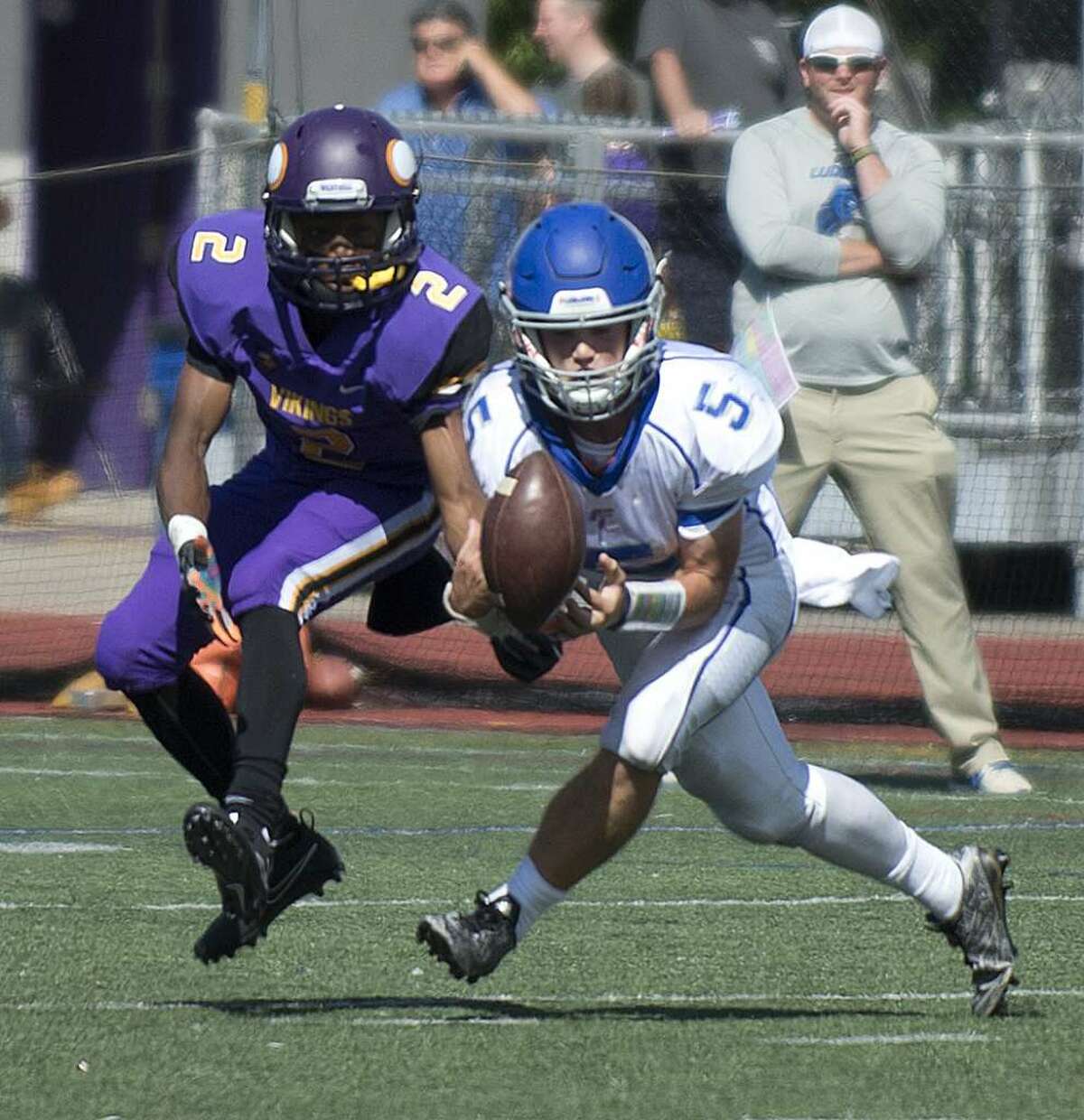 Fairfield Ludlowe’s Kevin Quinn breaks up a pass vs. Westhill last season. (Lindsay Perry, For Hearst Connecticut Media)