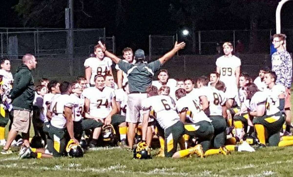 Tony Bonito (center) addresses his Coventry Co-op team after a victory last season. The Patriots went 10-0 and won the Pequot Uncas Division (Photo