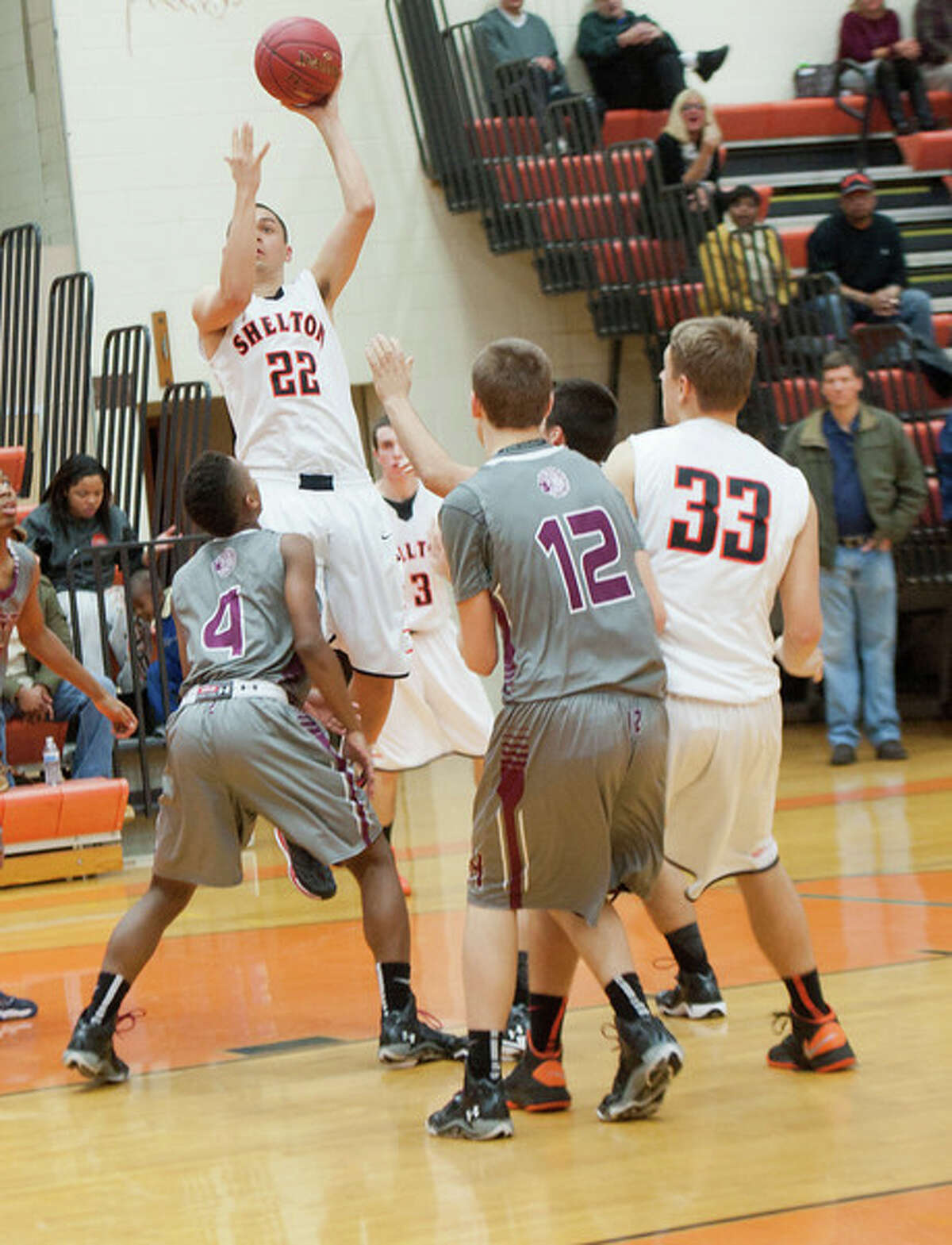 Shelton’s Patrick Murphy puts up a shot during the Gaels’ victory over North Haven Tuesday. (Melanie Stengel — Register)