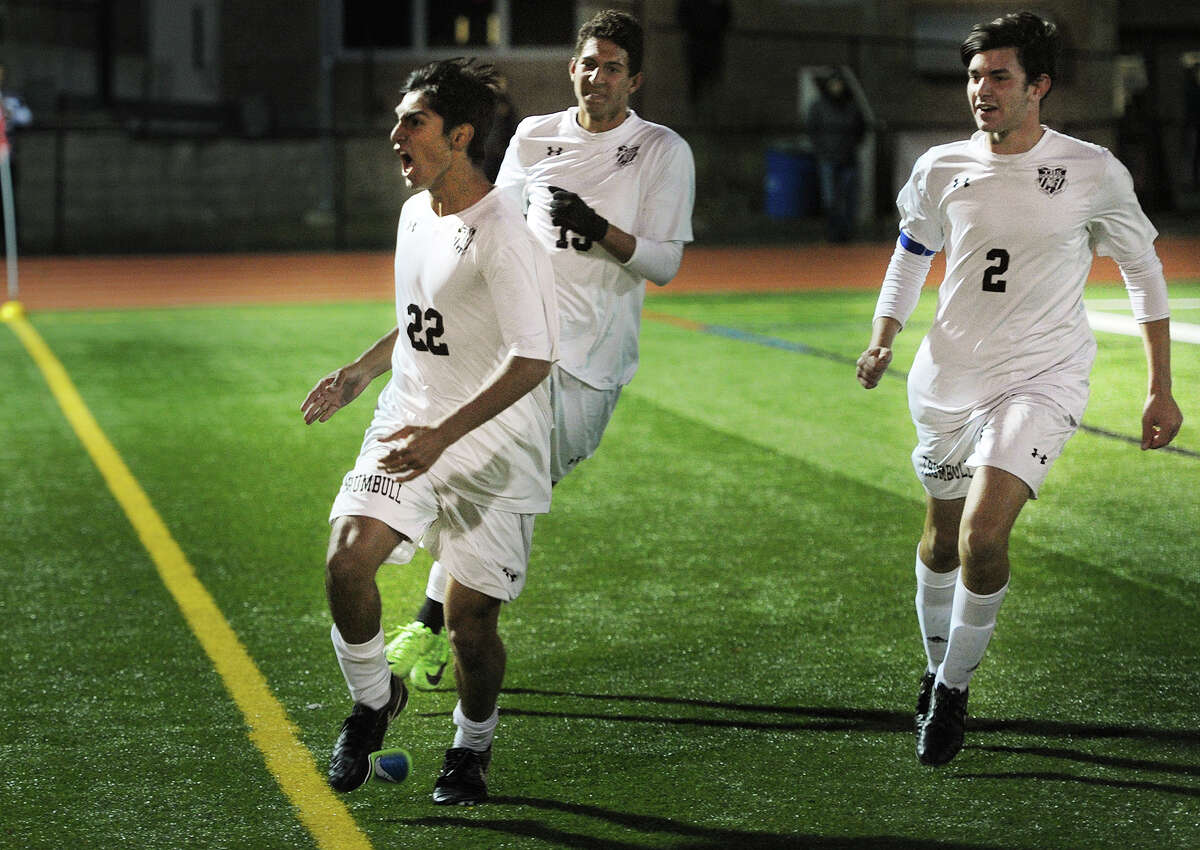 From left; Trumbull's Andrew Restrepo celebrates his overtime goal with teammates Matheus Santiago and Nicholaos Xanakis to give his team a 1-0 victory over Danbury in the FCIAC Boys' Soccer Semi-Finals at Ludlowe High School in Fairfield, Conn. on Monday, October 30, 2017.