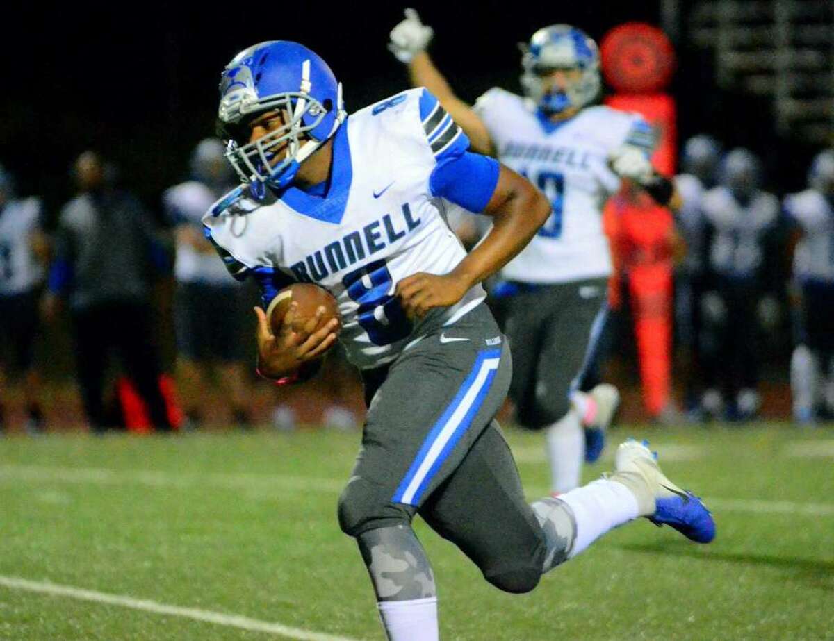 Bunnell's Jovan Eggleston carries the ball to the end zone to score a touchdown during high school football action against Foran in Milford, Conn., on Friday Oct. 12, 2018.