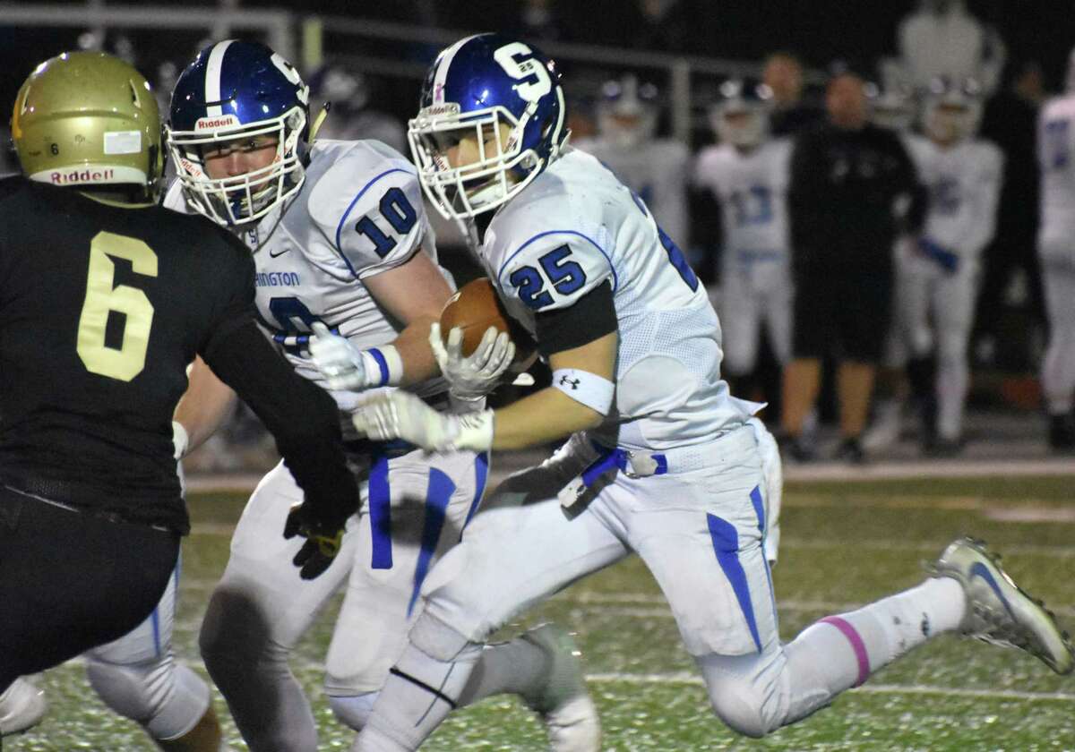 Southington’s Tanner LaRosa breaks a tackle against East Hartford on Friday, Oct. 26, 2018. (Pete Pagauga, Hearst Connecticut Media)