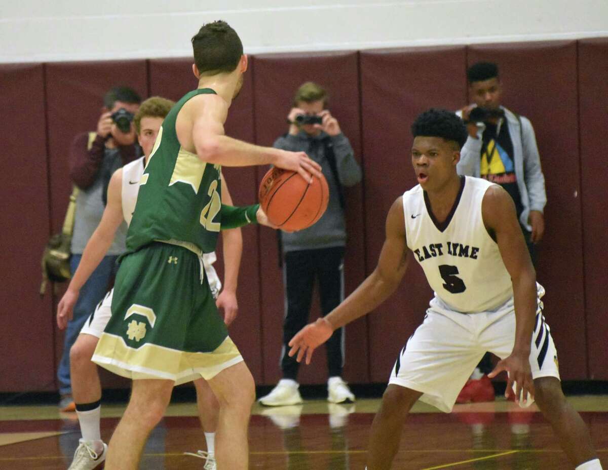 East Lyme’s Dev Ostrowski guards Notre Dame-West Haven’s Connor Raines at East Lyme on Saturday, December 15, 2018. (Pete Paguaga, Hearst Connecticut Media)