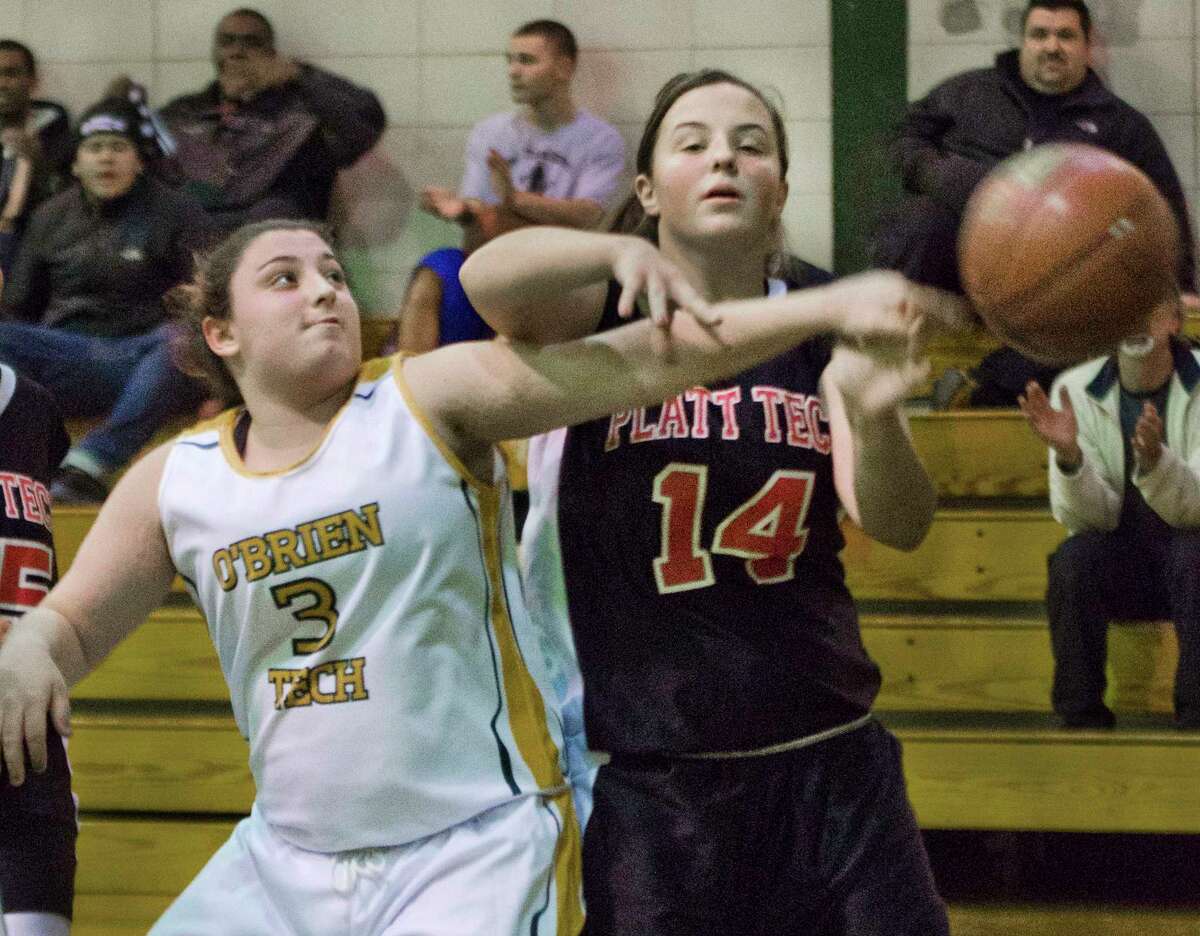 O’Brien Tech’s Nicole Belade, left, fights for a rebound. Belade is also fighting Ulcerative Colitis. however, she said it is a fight she will win. (Melanie Stenge — Register)