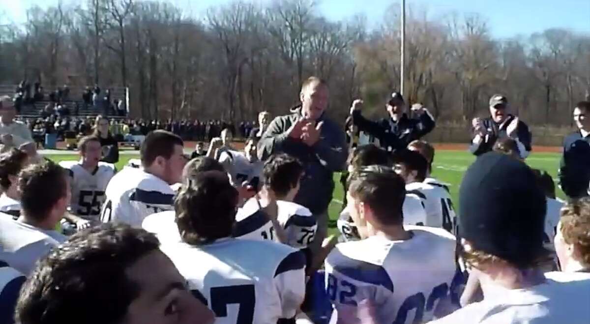Weston’s Joe Lato (center) celebrates a state-playoff clinching victory over Barlow on Thanksgiving in 2012. It was only the second state playoff berth in Weston’s history. Lato has been hired as Masuk’s football coach. (Screen cap Sean Patrick Bowley)