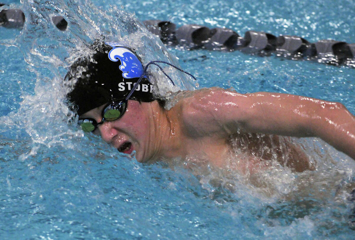 Darien’s Jack Stobbie competes in the 500-meter freestyle during the Wave’s 108-74 win over Staples in Westport on Friday, Jan. 4. — Dave Stewart/Hearst Connecticut Media photo