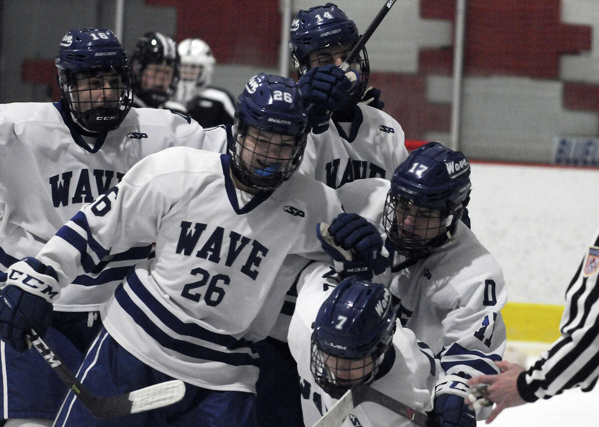 The Darien Blue Wave celebrates a first-period goal during their boys ice hockey game against Xavier on Saturday, Jan. 5, at the Darien Ice House. — Dave Stewart/Hearst Connecticut Media photo