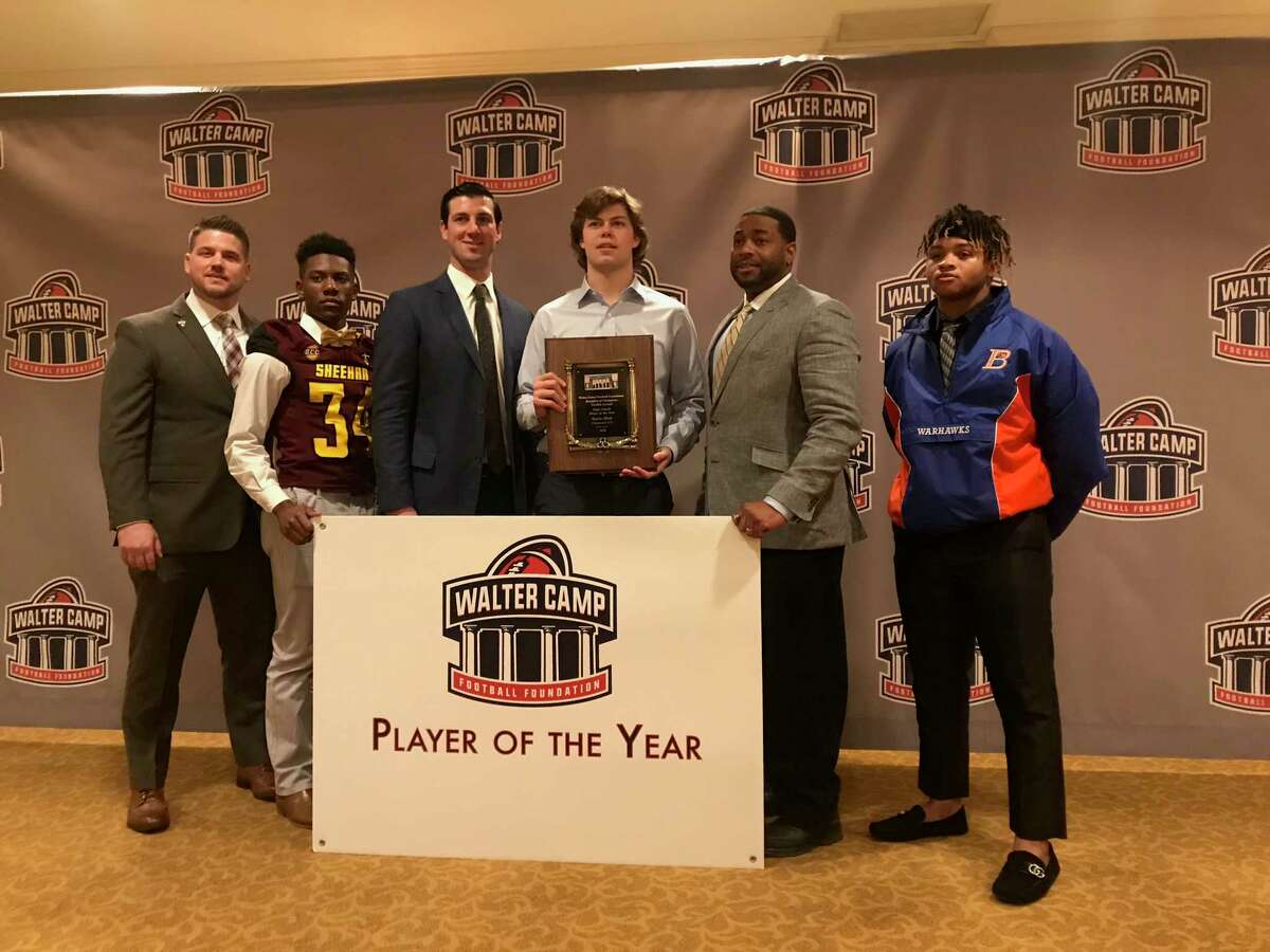 Coach of the Year John Marinelli and Player of the Year Gavin Muir during the Walter Camp Football Foundation's 12th Annual Breakfast of Champions at the Omni Hotel in New Haven on Saturday, January 12, 2019.