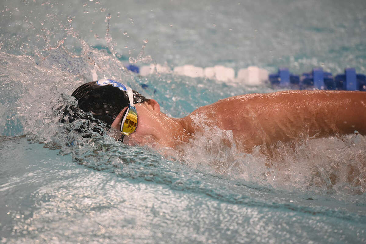 Darien’s Karl Wadleigh swims in the 500 freestyle during a swim meet at the New Canaan YMCA on Wednesday, Jan. 23.