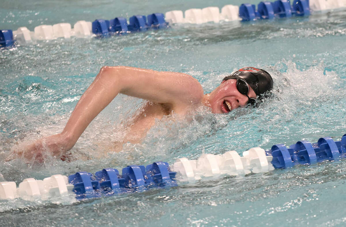 New Canaan’s Jake Ritz swims in the 500 freestyle during a swim meet at the New Canaan YMCA on Wednesday, Jan. 23.