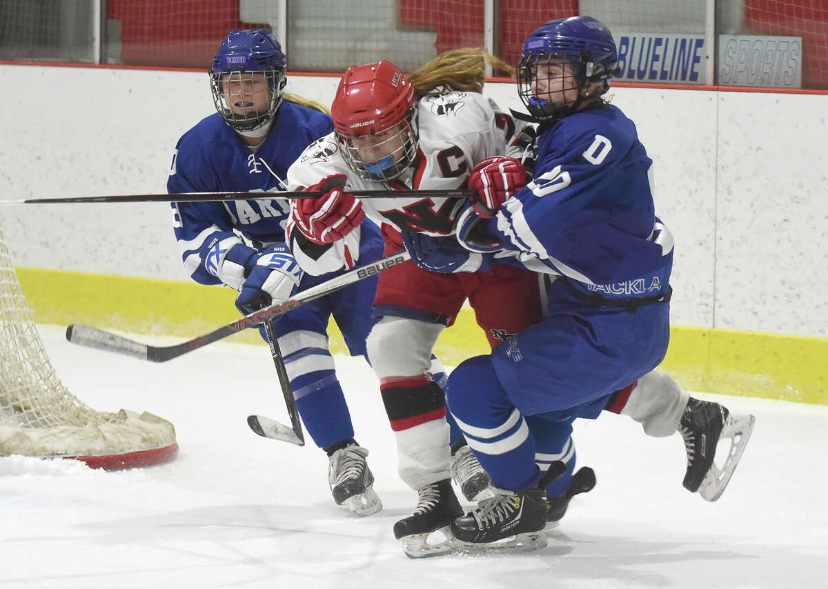 Darien and New Canaan skate to 11 tie in rivalry thriller