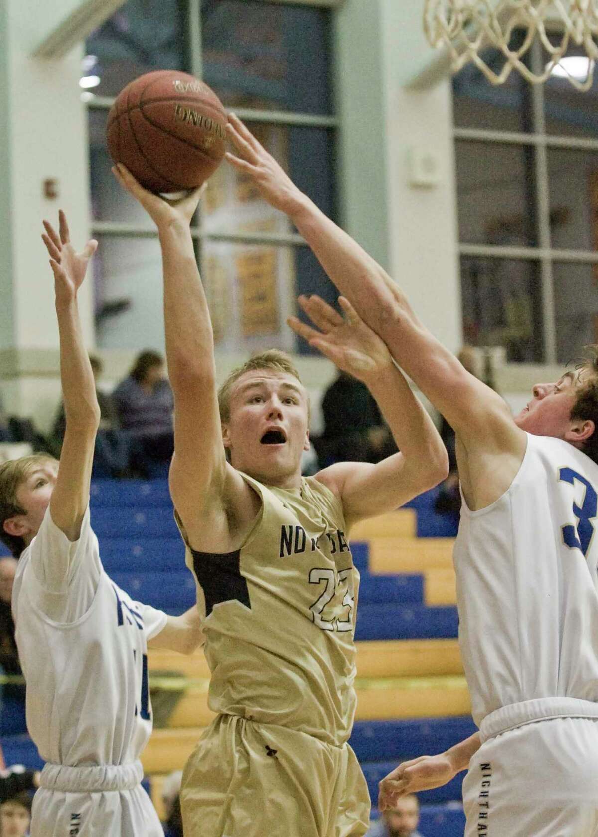 Notre Dame-Fairfield High School's Max Mitchell tries to get a shot off in a game against Newtown High School, played at Newtown. Friday, Jan. 18, 2019