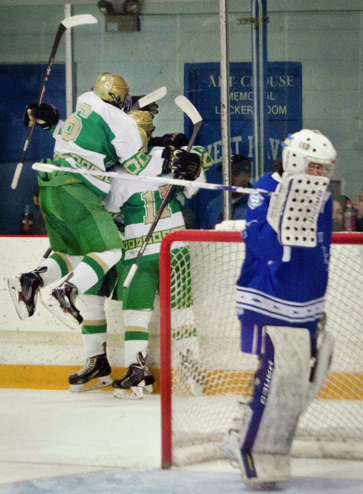 (Melanie Stengel — New Haven Register) West Haven goalie, Michael Savino, stands by as Notre Dame West Haven celebrates their first goal n 2nd period action