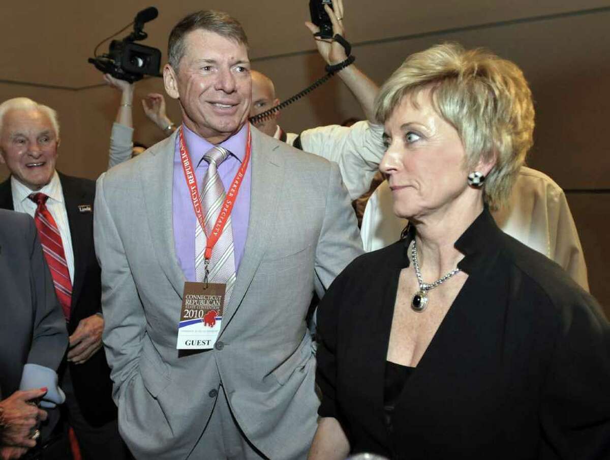 Republican candidate for U.S. Senate Linda McMahon, right, and husband Vince McMahon, left, wait for delegate totals to be tallied during the Republican nomination at the Connecticut Republican Convention in Hartford, Conn., Friday, May 21, 2010. (AP Photo/Jessica Hill)