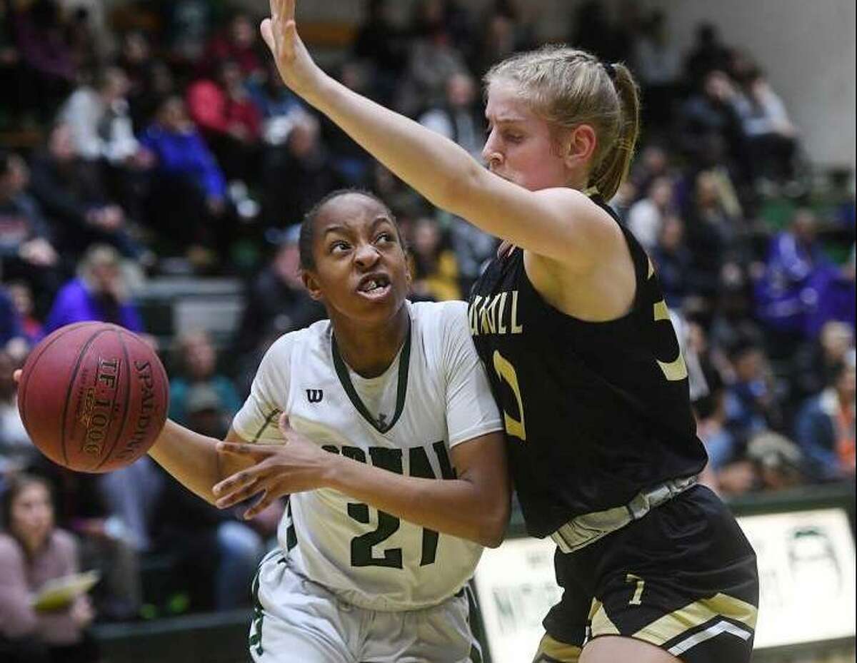 Norwalk’s Jakara Murray-Leach drives the ball to the basket against Trumbull defender Allie Palmieri in their FCIAC girls basketball matchup at Norwalk High School in Norwalk, Conn. on Monday, February 11, 2019. (Photo Brian Pounds / Hearst Connecticut Media)
