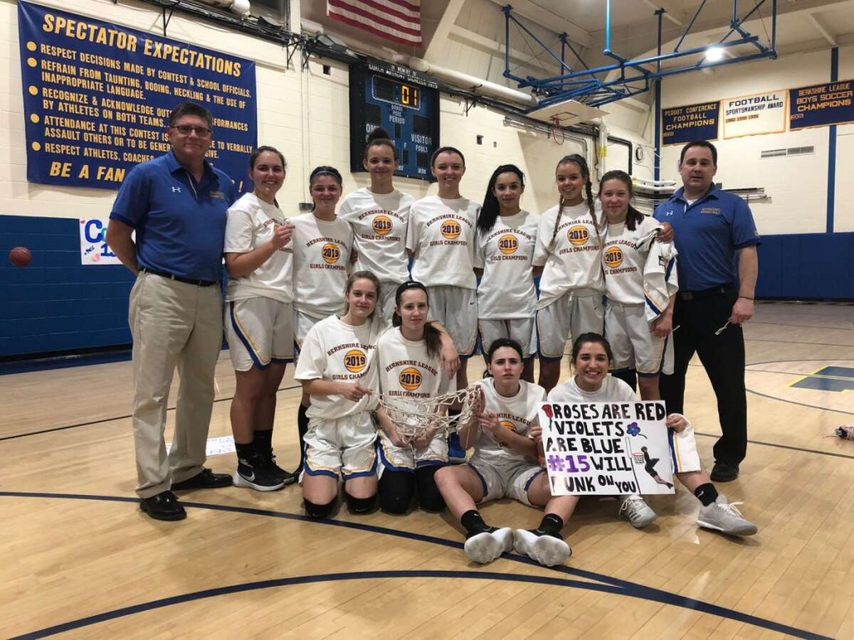 Housatonic Regional’s girls basketball team poses after cutting down the nets to celebrate their 2019 Berkshire League championship on Thursday, Feb. 14, 2019. Housatonic is the top seed in the league tournament, which tips off Saturday, Feb. 16 at higher seeds. (Photo