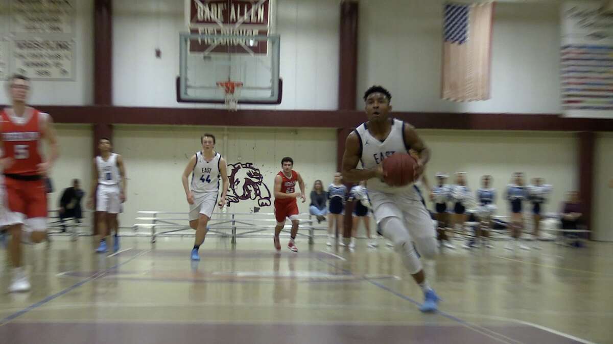 East Catholic’s Jaylin Hunter goes to the basket on the break during the CCC quarterfinals.