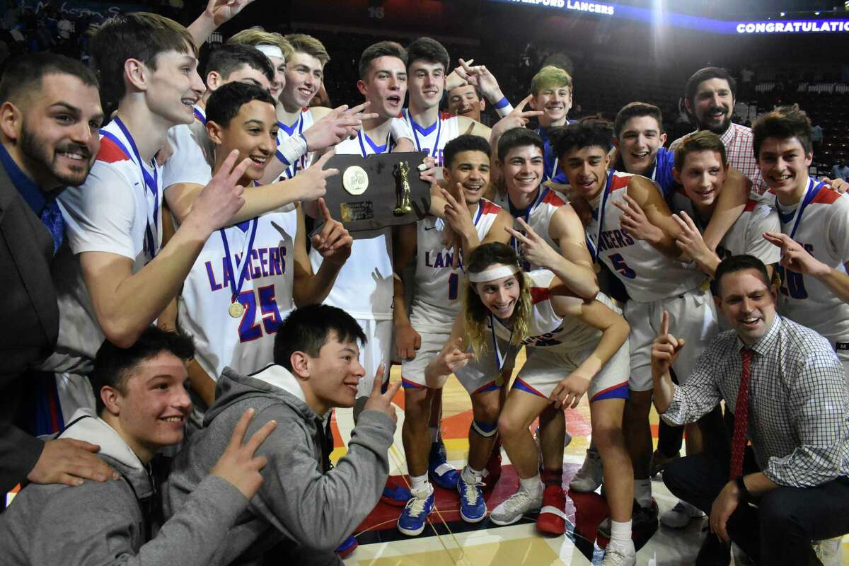 Action between Waterford and New Britain during the Division II boys basketball championship at Mohegan Sun on Sunday, March 17, 2019. (Pete Paguaga, Hearst Connecticut Media)