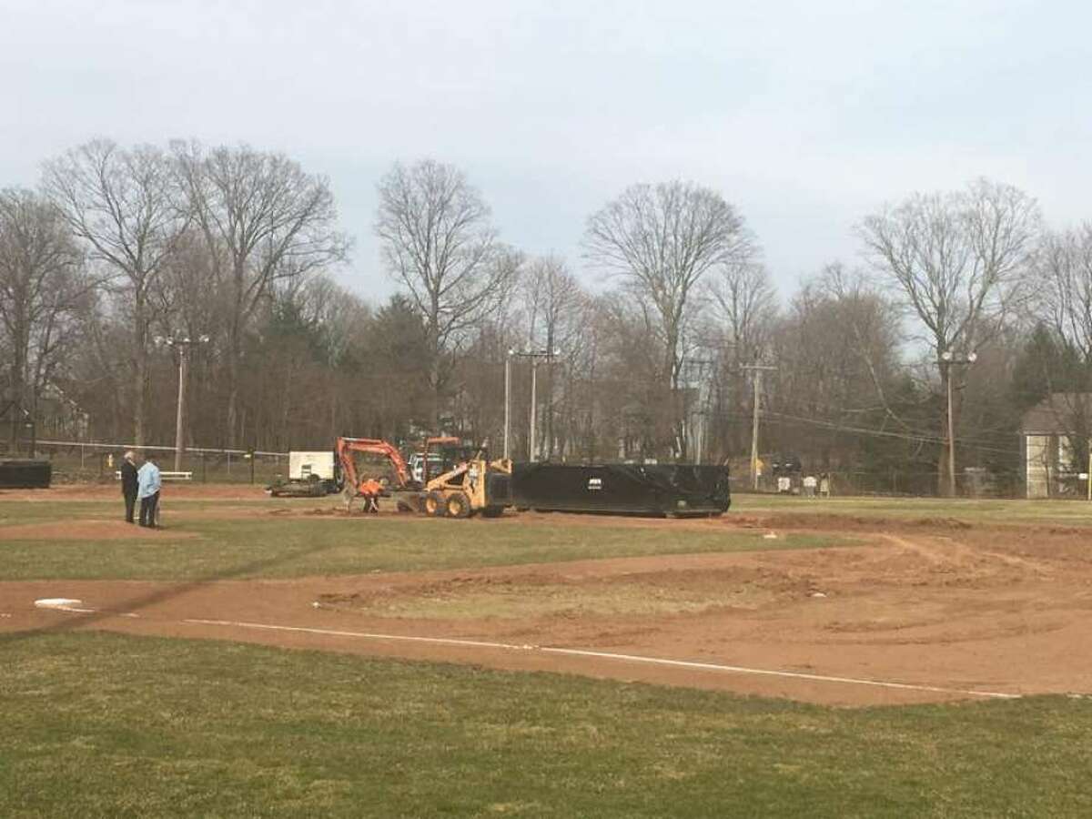 Ridgefield town officials examine the damage done to Ciuccoli Field on Sunday, April 7, 2019.