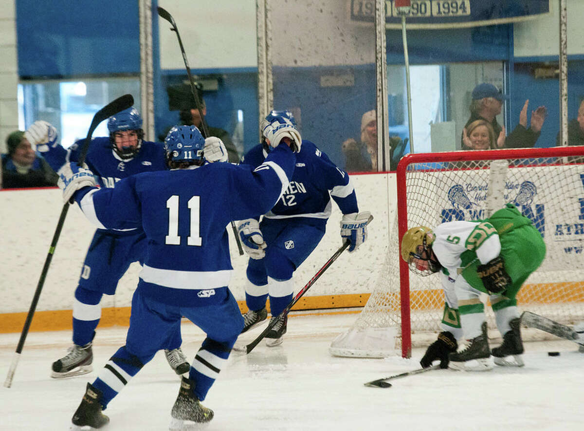 Darien’s hockey team celebrates a goal by Dillon Fitzpatrick in Monday’s 2-1 OT victory over Notre Dame-WH at Bennett Rink (Photo Melanie Stengel)