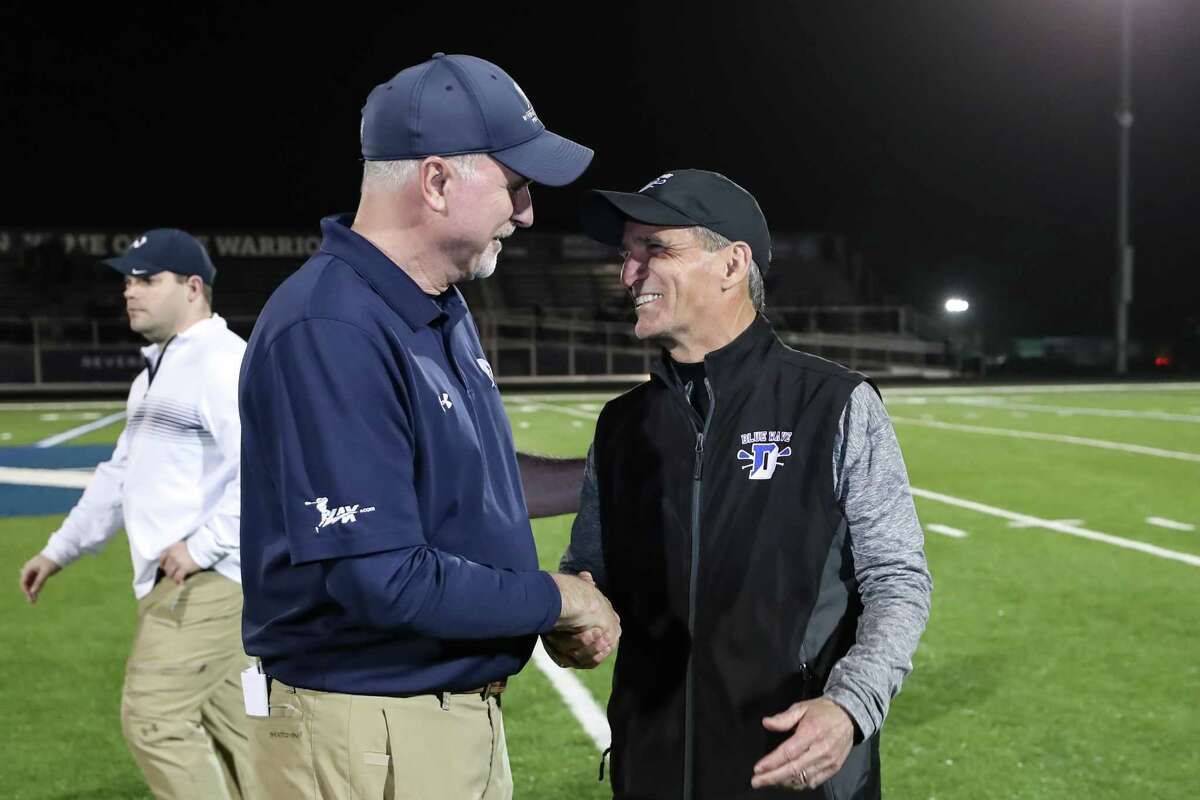 Darien Head Coach Jeff Brameier is congratulated by Wilton Head Coach Steve Pearsall for his 600th win just after a game between Darien Boys Varsity Lacrosse and Wilton Boys Varsity Lacrosse on April 18, 2019 at Wilton High School in Wilton, CT.