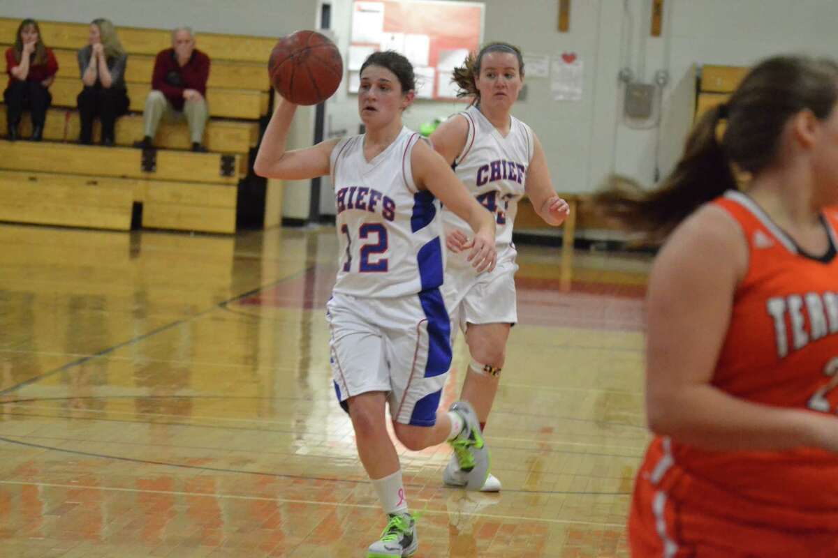 Nonnewaug’s Megan Mitchell looks to make a pass in the Chiefs 42-37 win over Terryville.