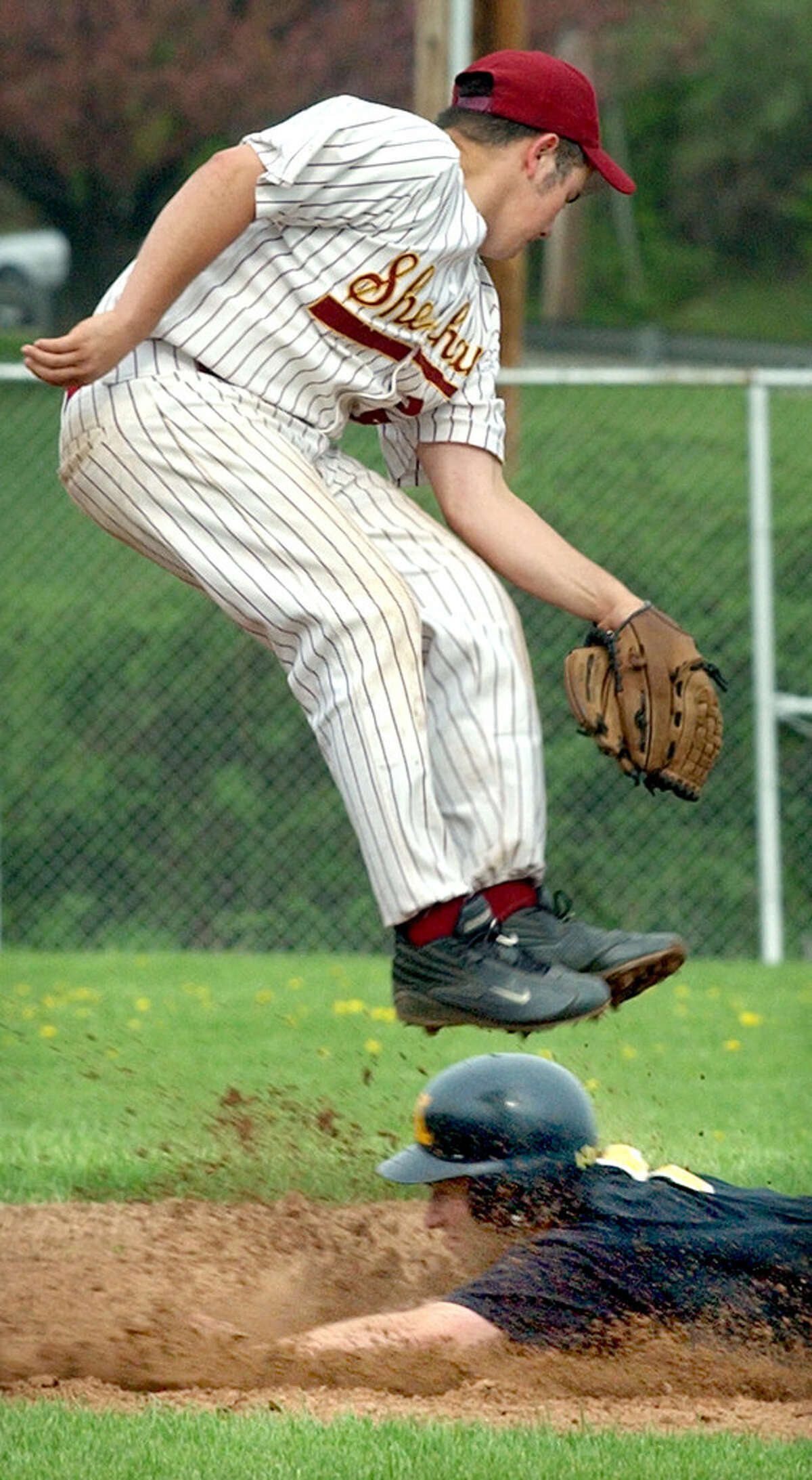 Norman Roth (bottom) of Amity steals second as Dom Lombardozzi of Sheehan gets airborne Friday in 2003. (Arnie Gold, Hearst Connecticut Media)