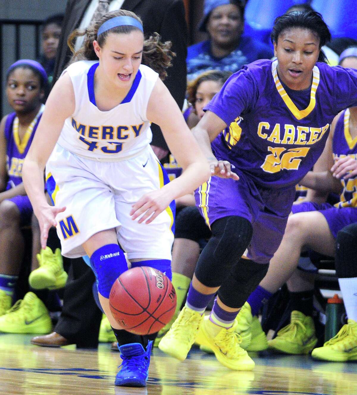 Haley Vanty (left) of Mercy moves the ball up the court after a Career turnover in the second half of the SCC Championship at the TD Bank Sports Center at Quinnipiac University in Hamden on 2/26/2014. (Arnold Gold-New Haven Register)