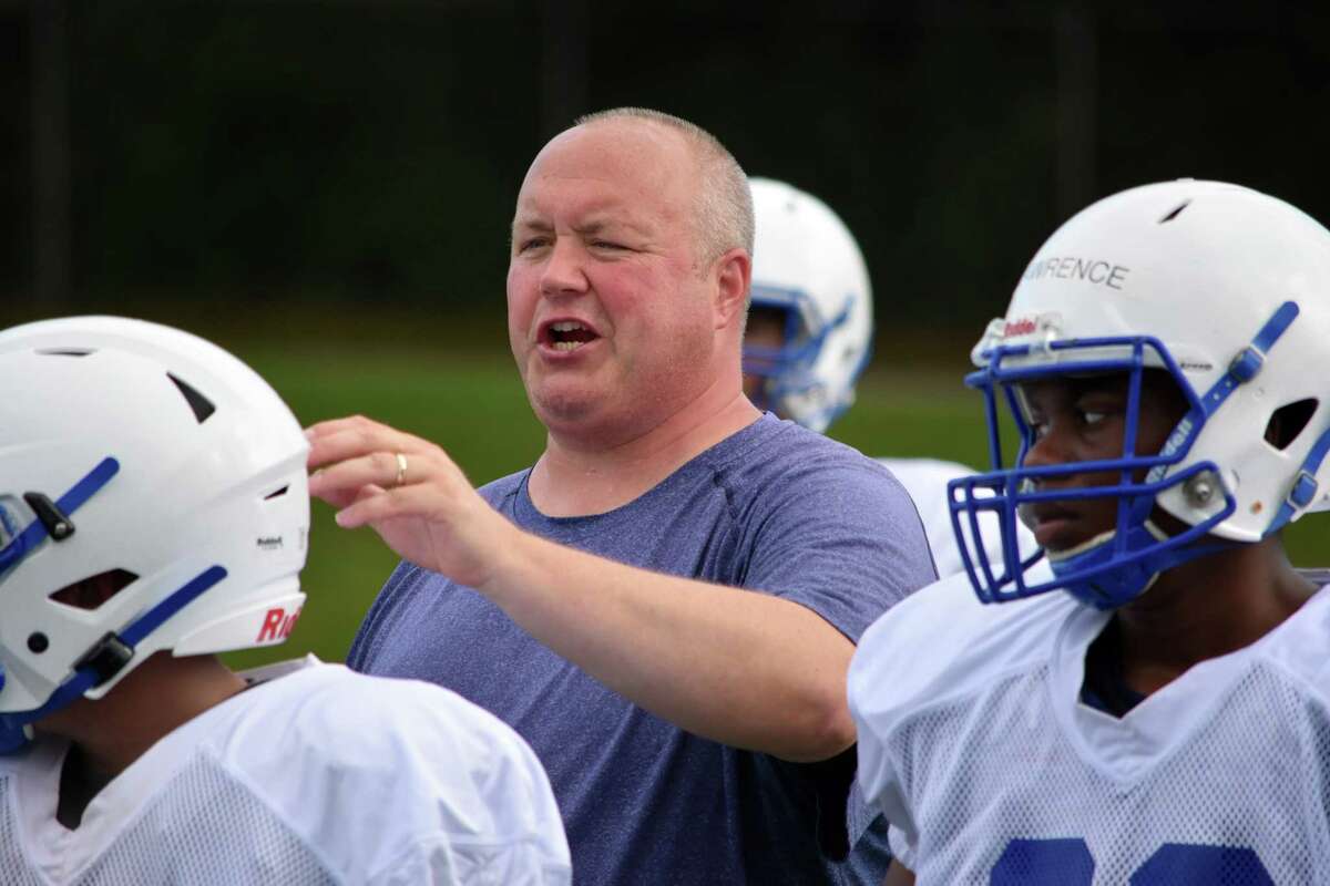 Glastonbury first-year coach Eric Hennessy coaches his players at practice on Thursday, August 22, 2019. (Pete Paguaga, Hearst Connecticut Media)