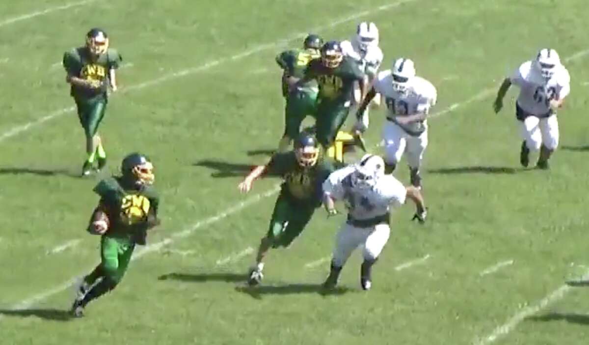 Coventry Co-Op’s Jordan Smith (bottom, left) looks for running room during a scrimmage this preseason (Screenshot / Hudl)