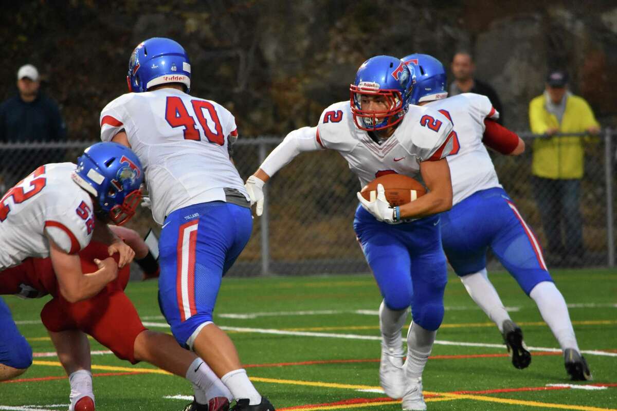 Tolland’s Ryan Carlson rushes the ball against Berlin at Berlin high school on Thursday, Sept. 12, 2019. (Pete Paguaga, Hearst Connecticut Media)