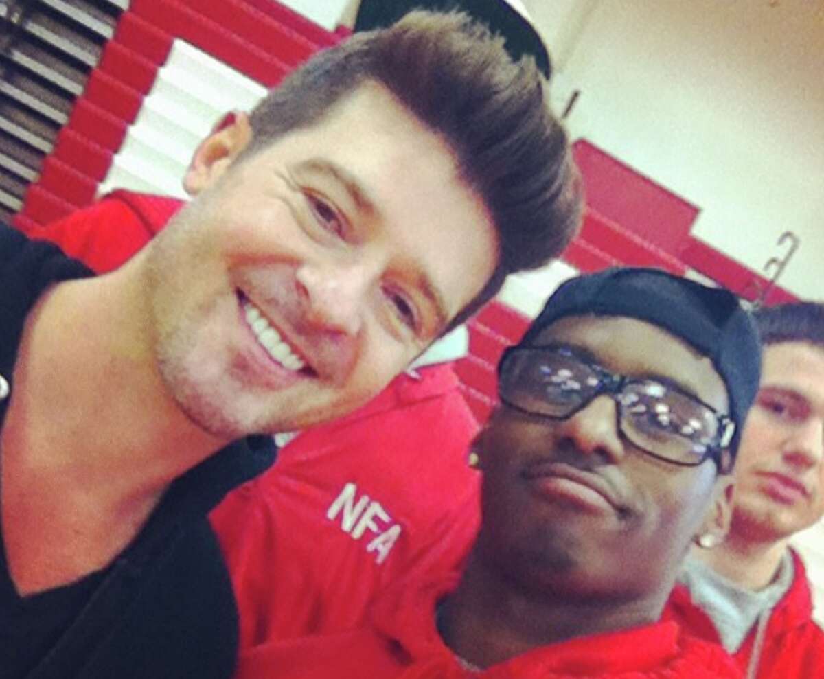Pop star Robin Thicke takes a selfie with NFA guard (and Boston College football commit) Marcus Outlow before his concert at Foxwoods. Outlow went on to hit a buzzer-beater to beat Waterford in the ECC tournament hours later [Marcus Outlow – Instagram)
