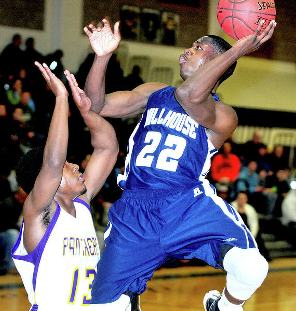 Amos Ford (left) of Career defends against Shane Christie of Hillhouse in the first half of the SCC Boys Basketball Semifinal in East Haven on 3/3/2014. Photo: Arnold Gold / Register