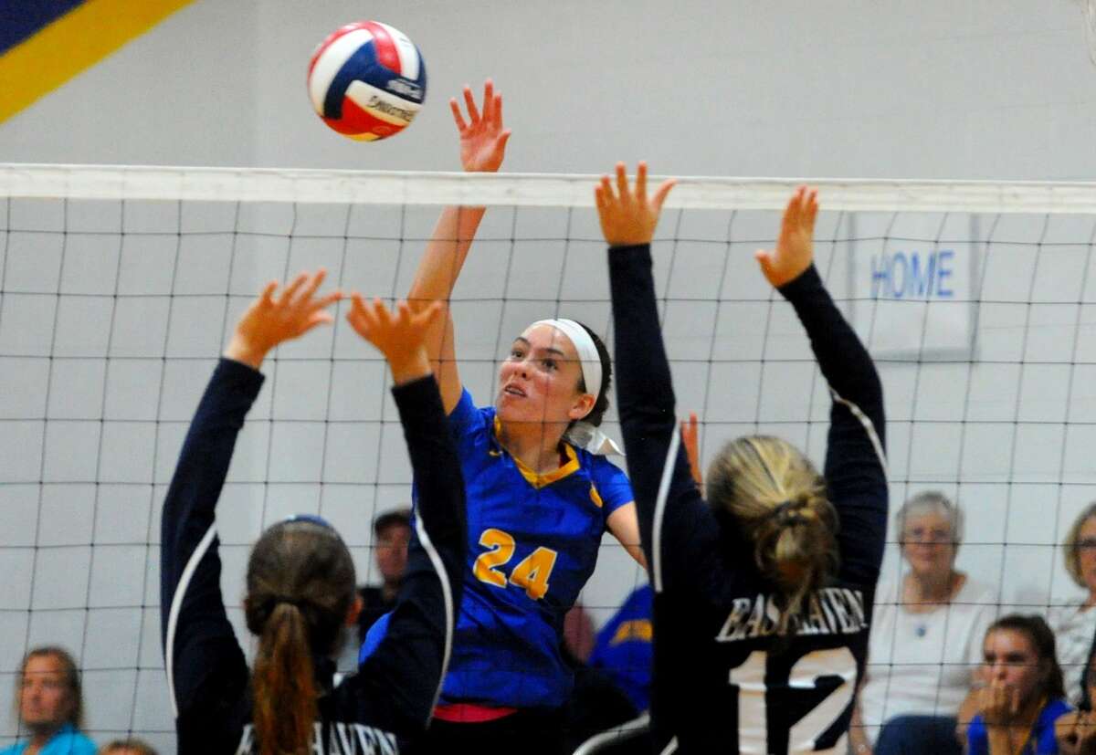 Seymour’s Faith Rousseau spikes the ball during girls volleyball against East Haven in Seymour, Conn., on Thursday Sept. 26, 2019.