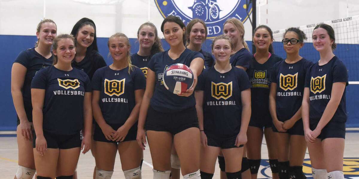 Woodstock Academy senior Paula Hernandez (center) and her teammates on the 2019 Centaurs' volleyball team.