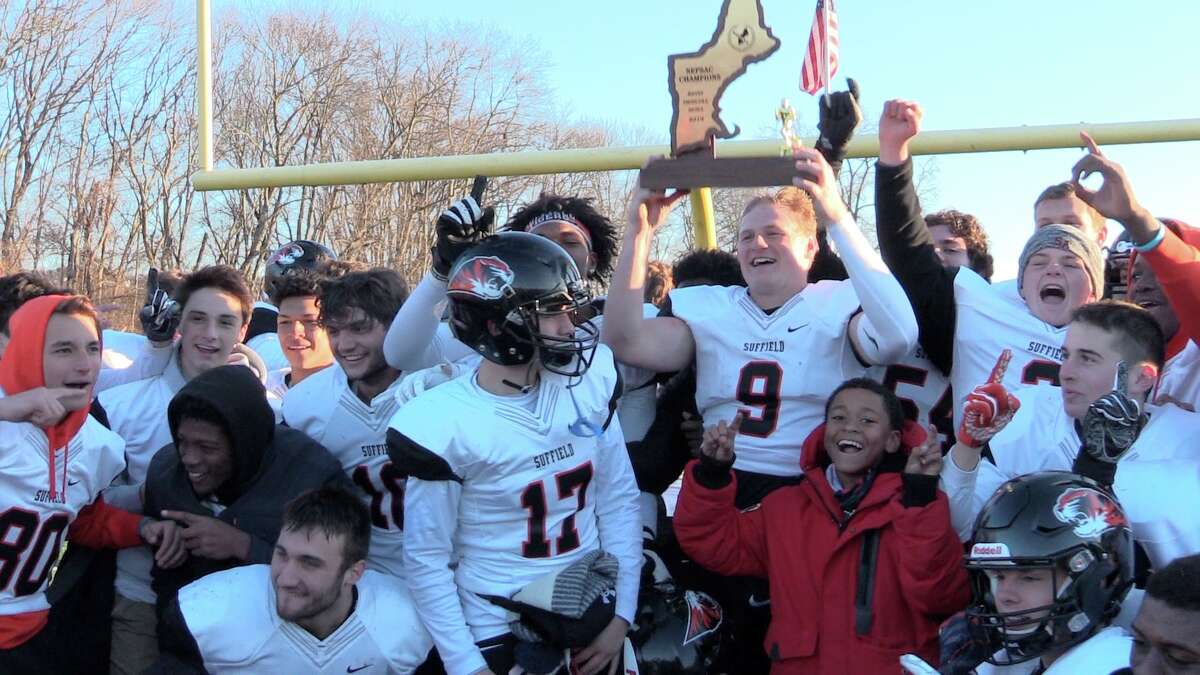Tyler Van Dyke (9) hoists the New England Championship trophy as Suffield Academy's football team celebrates its 29-21 victory over Avon Old Farms in the NEPSAC A Kevin Driscoll Bowl, Saturday, Nov. 16, 2019 at Ryan Field in Avon.