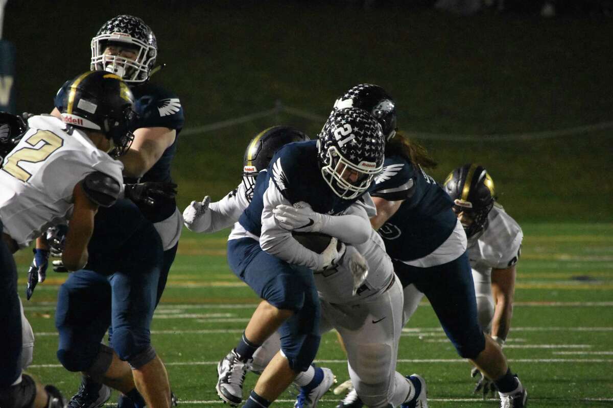 Wethersfield’s John Orsini runs the ball in the football game between Newington and Wethersfield at Wethersfield on Wednesday Nov. 27, 2019. (Pete Paguaga, Hearst Connecticut Media)